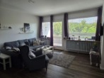 Wohnzimmer / Loggia - 1-Zimmer-Eigentumswohnung in Hahnenklee